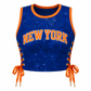 A blue sequined crop top with orange trim, featuring 'NEW YORK' printed in orange across the chest and orange side laces tied at the waist, shown on a plain white background.