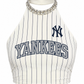 A white halter crop top with navy blue pinstripes, featuring a navy blue New York Yankees logo on the chest and a rhinestone-embellished collar, shown on a plain white background.