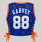GARVEY royal blue lace cropped basketball jersey featuring white GARVEY nameplate and white number 88 with orange rib trim and satin lace-up sides.