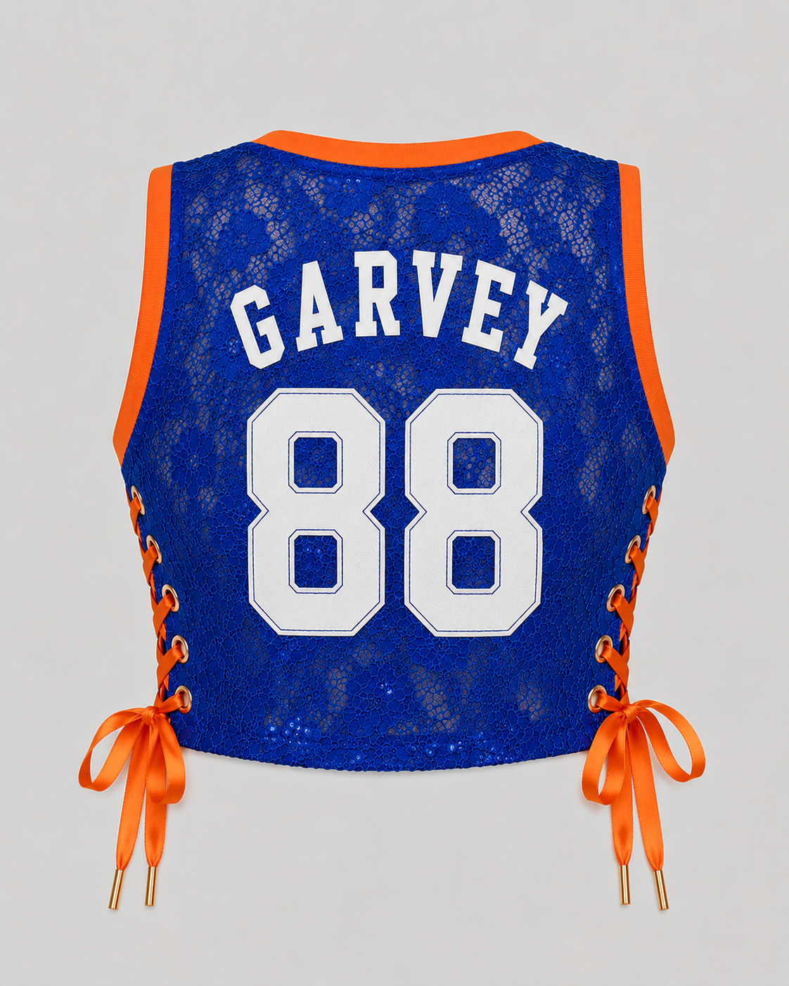 GARVEY royal blue lace cropped basketball jersey featuring white GARVEY nameplate and white number 88 with orange rib trim and satin lace-up sides.
